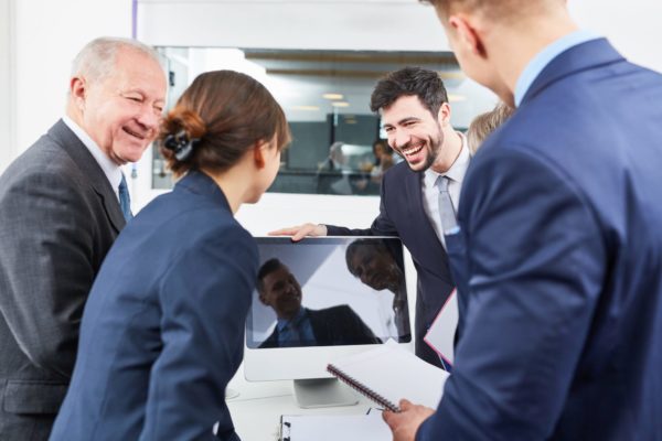 Business-people-use-social-media-scaled